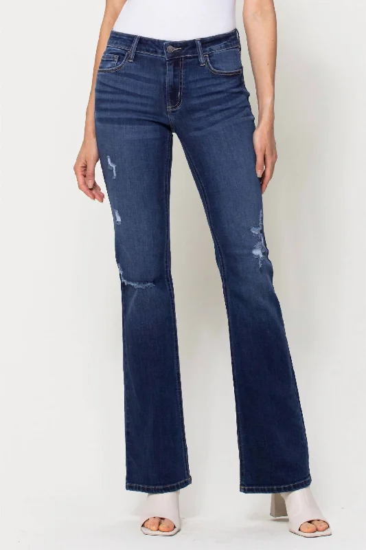 Mid Rise Distressed Flare Jeans In Medium Wash